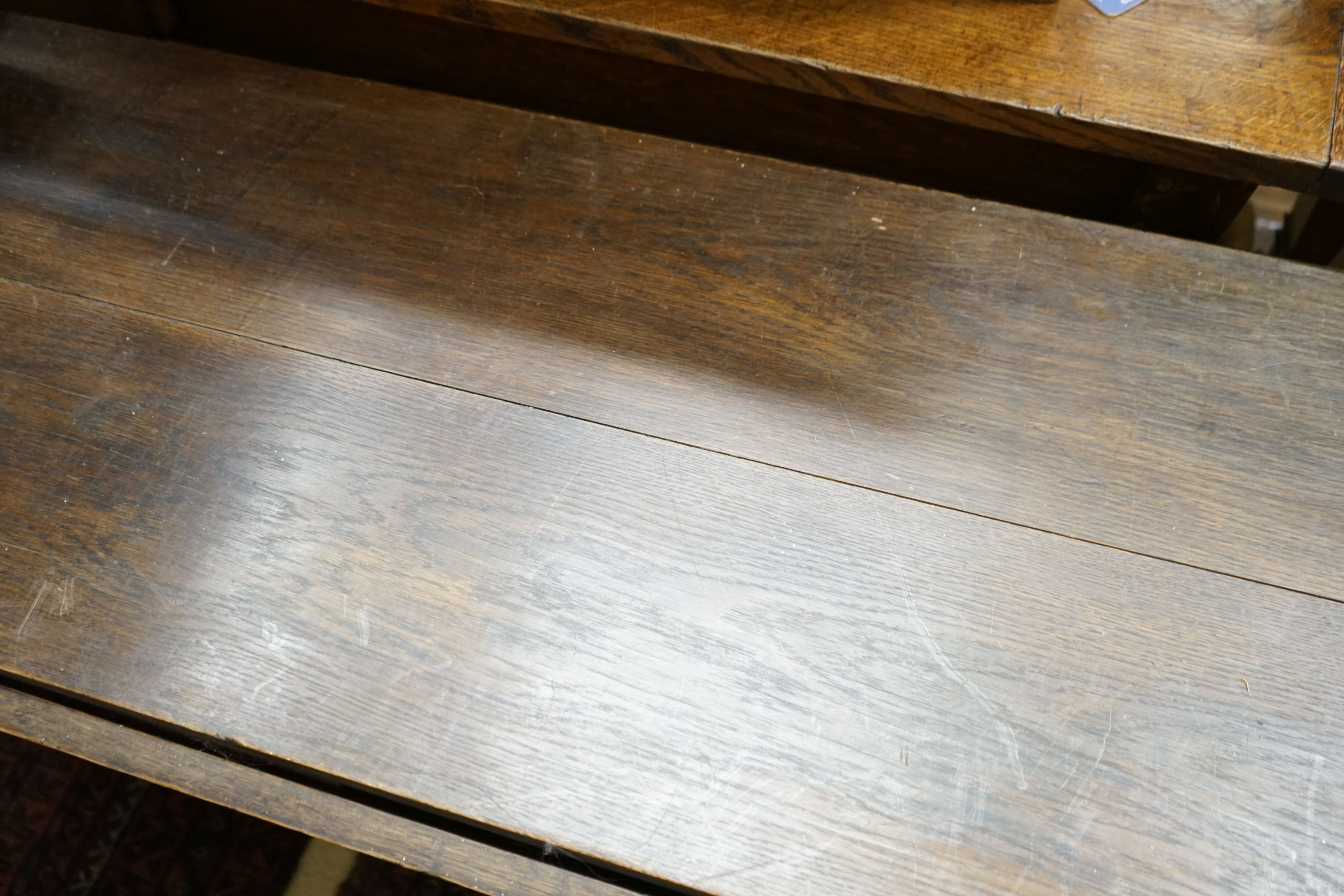 An 18th century style oak gateleg dining table, width 112cm, 140cm extended, height 68cm